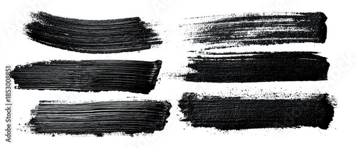 Black paint strokes on white background, various shapes and textures