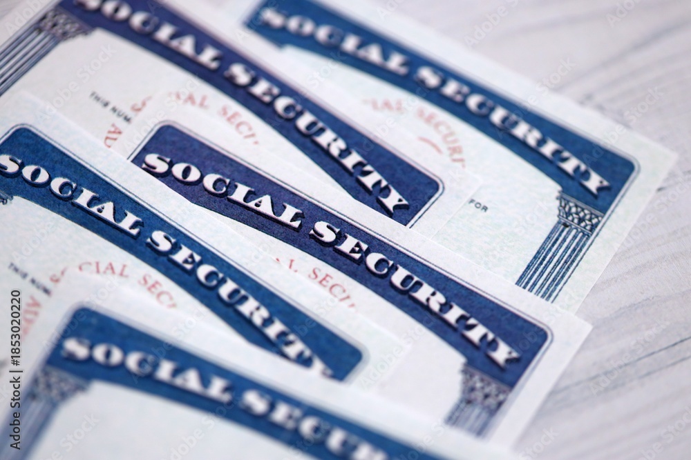 Obraz premium Social security number cards on white wooden background surface close up