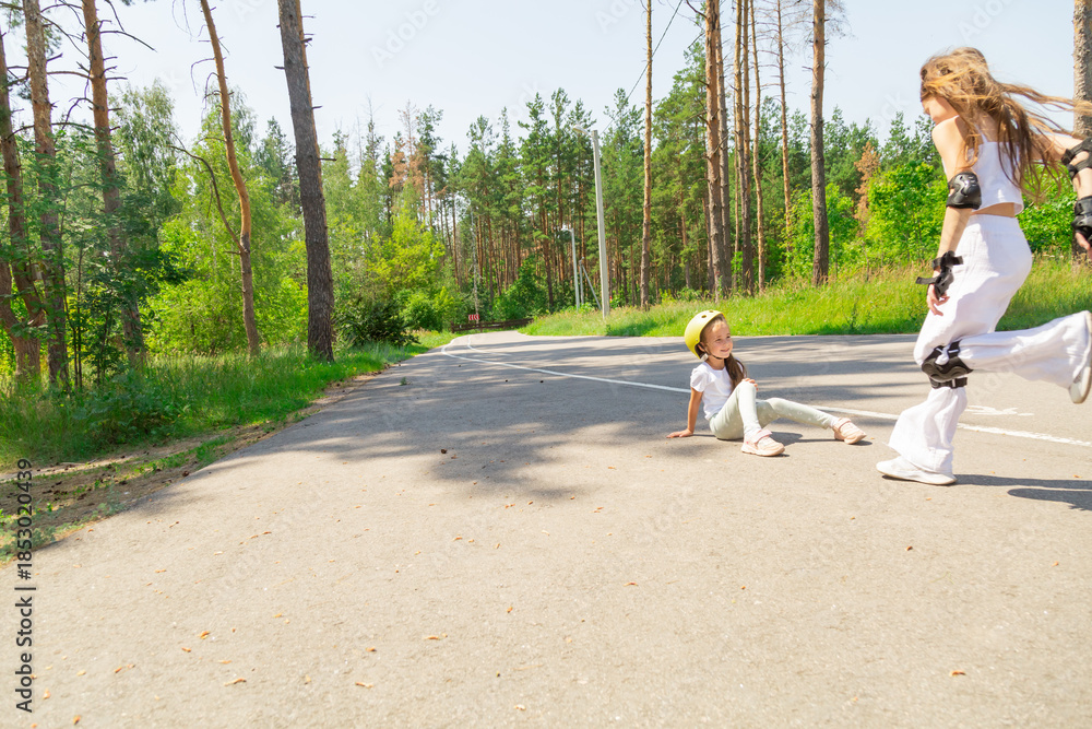 Obraz premium Children skateboarding in the forest