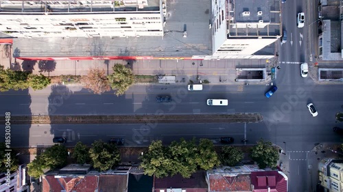 Wallpaper Mural Aerial view of cars moving along a street lined with buildings and trees, showcasing the urban landscape, Varna, Varna, Bulgaria. Torontodigital.ca