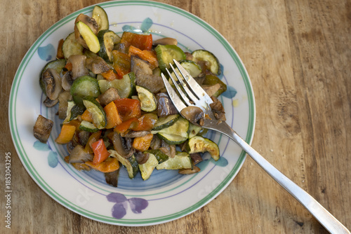 sauteed mixed vegetables with fork on plate for healthy meal