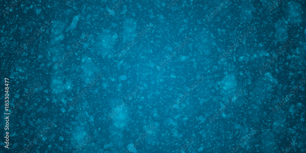 Naklejka premium Fondo navideño azul en degradado con copos de nieve difuminados y destellos de luz invernal