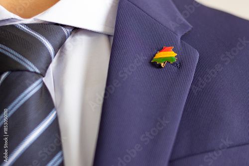 Tableau sur toile Man wearing bolivian map flag lapel pin on suit