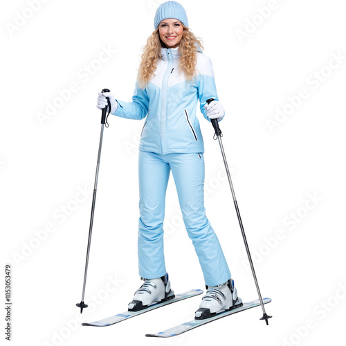 Female skier posing on skis with poles in winter sports attire  