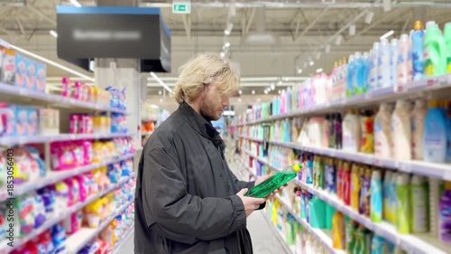 Choosing washing powder ,detergent,liquids at Groceries.