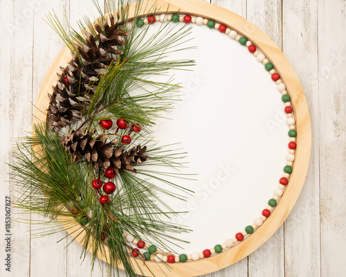 Christmas holiday round flatlay with room for adding words or invitations.