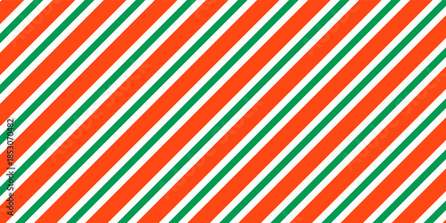 Christmas seamless pattern. Red and green diagonal stripes background. Candy cane repeating decoration wallpaper. Winter holiday lines backdrop. Xmas peppermint present wrapping print design. Vector