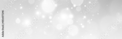 Abstract bokeh light background with blurred glow path and dynamic starburst explosion design.