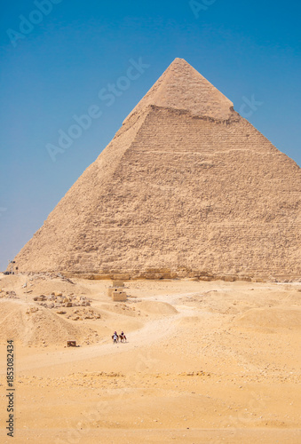 The Giza Pyramids in Cairo, Egypt, panoramic view. General view of the pyramids from the Giza plateau. Three pyramids, known as the Queen's Pyramids, are on the front.
