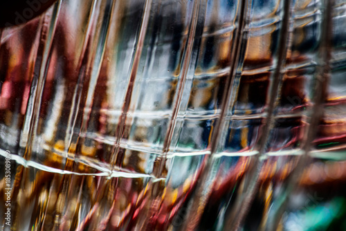 Wallpaper Mural Textured Translucent Glass Grid, an Abstract Macro Study of Warped Ridges and Layered Reflections in Amber, Blue, Red, and Green Light Flowing Across a Glossy Surface with Soft Motion Blur!! Torontodigital.ca