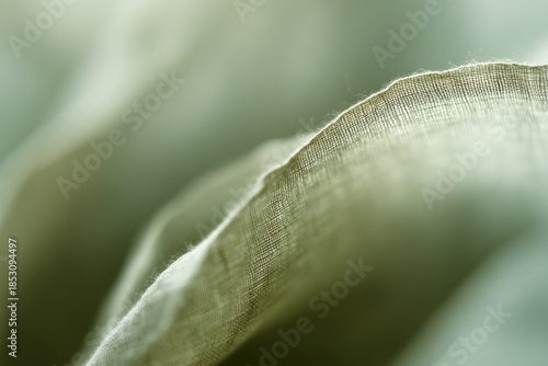 Soft fabric drapes gently, highlighting its texture and color under natural daylight