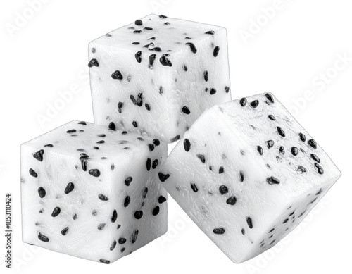 Close-up of three cube-shaped pieces of a tropical fruit, with a white interior and black seeds