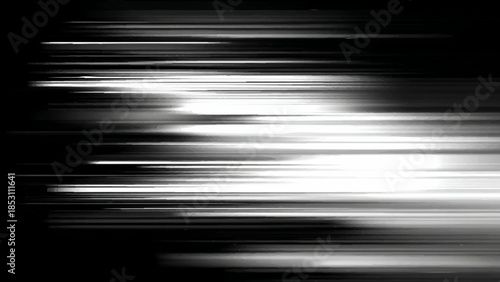 Blurry white light streaks on black background