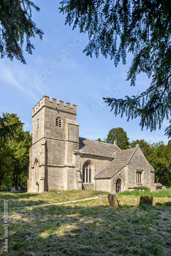 The parish church of St Peter dating back to the 13th century in the Cotswold village of Alvescot, Oxfordshire, England UK