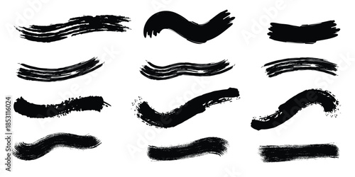 Collection of black brush strokes and marks on white background