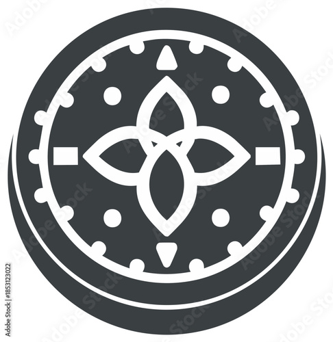Stylized circular emblem with flower like design in the center on dark background