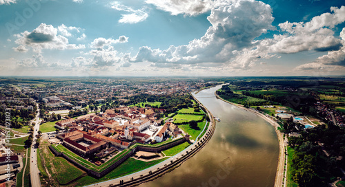 Aerial view of the star-shaped fortress Vauban, its red roofs contrasting with the green fields, beside the Drava River, Osijek, Osijek-Baranja County, Croatia.
