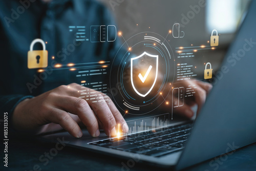 Cybersecurity concept with businessman working on laptop and virtual lock icon image