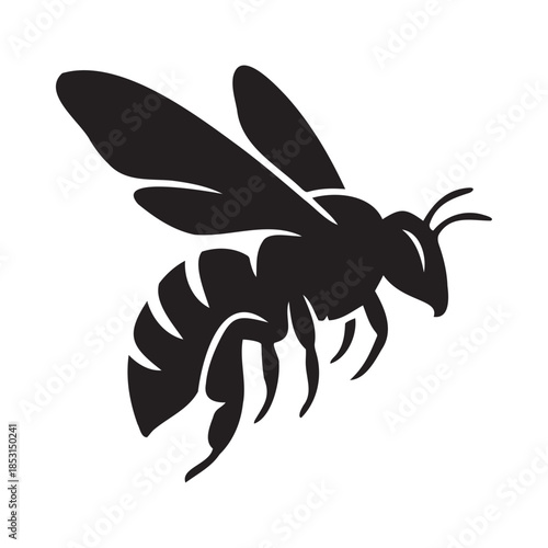 Dark silhouette of a flying bee against black background
