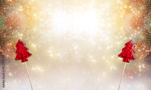 Christmas background with candy sweet lollipop in fir tree shape and cones for decoraton. New Year winter holidays fantasy concept with decorations and copy space, snowy shiny wide banner.