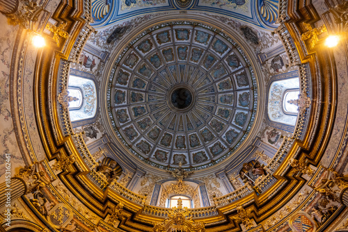 Intricate dome ceiling with frescoes and ornate details