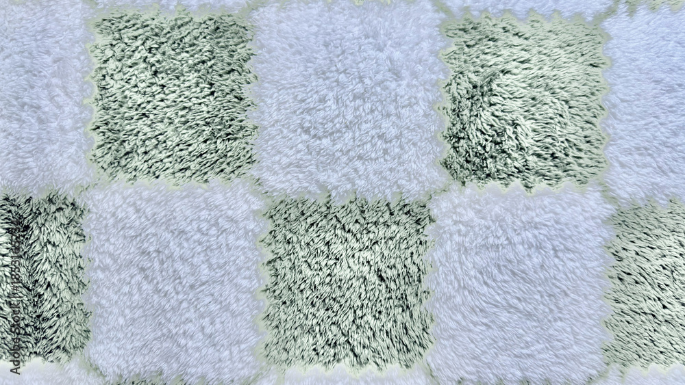 Fototapeta premium shaggy checkerboard rug texture in mint green and white fuzzy squares closeup for cozy home wallpaper or abstract design background