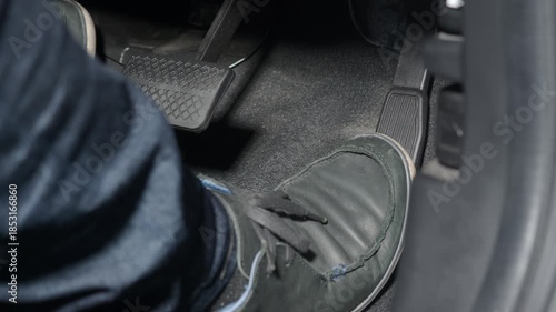 Accelerate and Brake. Foot pressing foot pedal of a car to drive ahead. Man driving car by pressing Accelerator and Brake in car. Driver driving the car by pushing accelerator pedals of the car inside