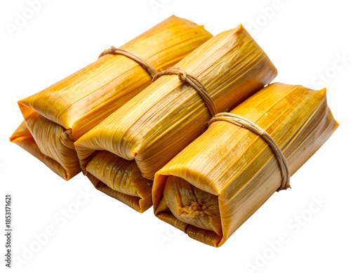 Stacked, tied food bundles wrapped in golden husks