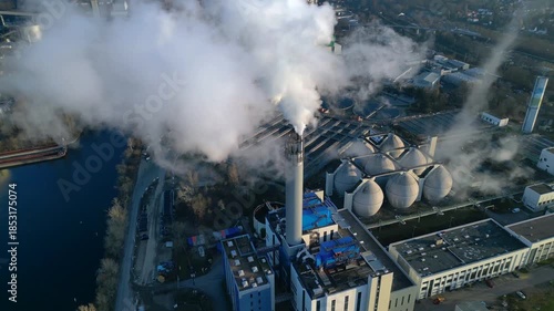 Plant chimney emitting smoke, global climate change. Magic aerial view drone