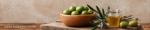 Wallpaper Mural Fresh green olives in wooden bowl with olive oil and branch on rustic wood table Torontodigital.ca