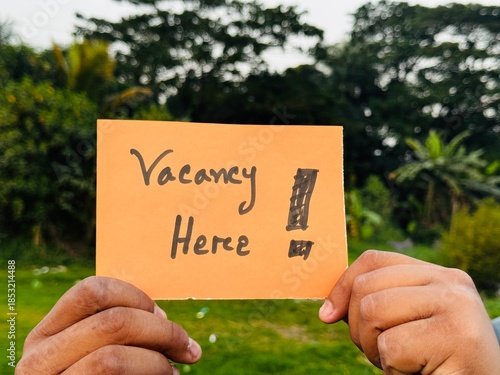 We are hiring trendy card post holding by hand, Join our team recruiting message, Drop your CV sticky note message, Vacancy here image