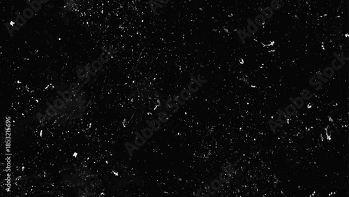 Film dust texture overlay for a retro effect. Grunge old film grit, grain, and scratches. Distressed overlay texture.