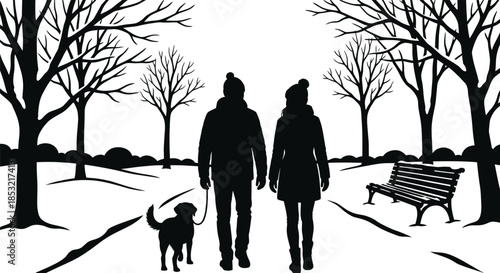 People walking dog in snowy winter park