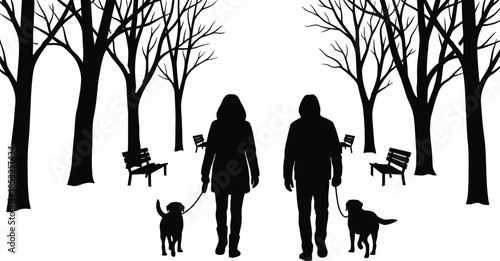 People walking dog in snowy winter park