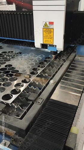 Laser cutting machine. Working process of laser cutting machine. Powerful laser beam for cutting. Cut stainless steel metal. Metal cutting machine. High precision, creating complex shapes CNC Vertical