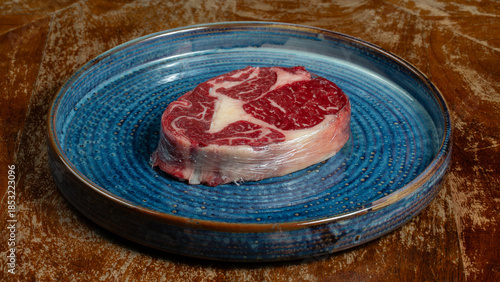 Raw beef meat for steak on plate plate