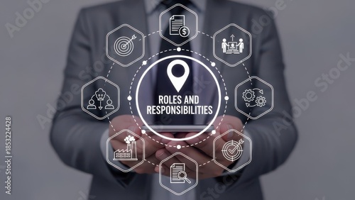 Business professional displaying 'Roles and Responsibilities' concept on tablet