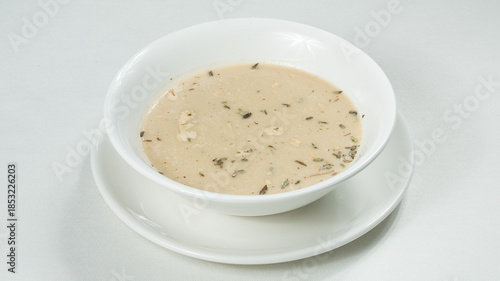 Bowl of mushrooms soup isolated