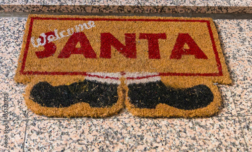 Festive touch to Christmas holiday decorations with charming Welcome Santa doormat