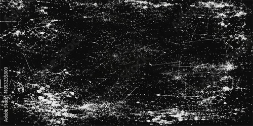 An abstract pattern of black and white paint splashes mixes with blue liquid drops and wet grunge textures on a cold frozen surface to create a fresh winter ocean wave