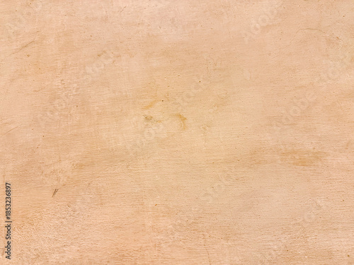 Beige rough plaster wall surface background texture
