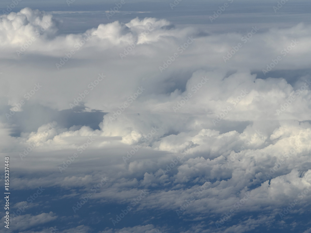 Fototapeta premium Aerial view of cumulus clouds creating a natural cloudscape atmosphere