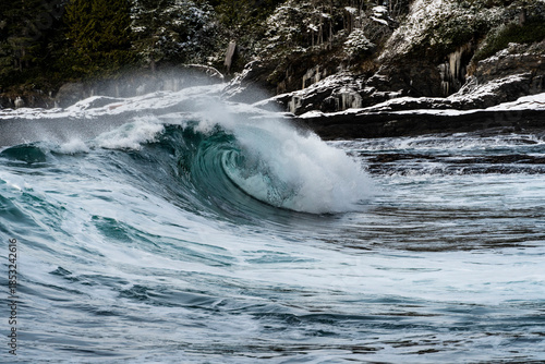 Powerful Ocean Wave Curling Near Rocky Shoreline - Vancouver Island, British Columbia, Canada