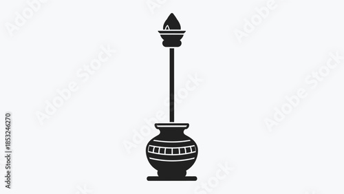 An illustration depicts a traditional oil lamp with a long wick and decorative pot on a table indoors.