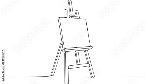 Blank artist's easel with canvas standing alone