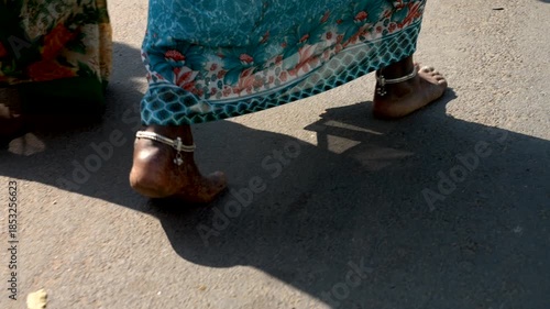 Close up feet Indian woman walkingon the street. Super Slow motion 4K