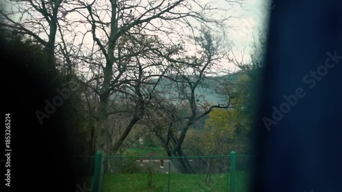 A beautiful view of nature from a train window during a journey. A railway in the mountains.