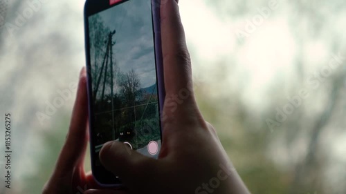 A beautiful view of nature from a train window during a journey. A railway in the mountains.