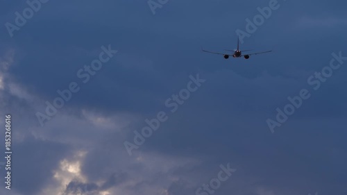 Jet airplane taking off and climbing at Phuket airport at sunset. Passenger flight departure