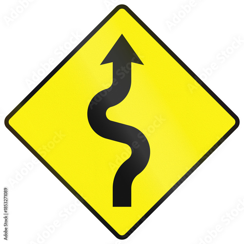 Obraz na płótnie Warning road sign used in Ireland - Series of sharp bends ahead, first to the ri